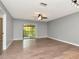 Spacious living room with sliding glass doors leading to a balcony at 1200 Tarpon Woods Blvd # M8, Palm Harbor, FL 34685