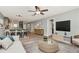 Open-concept living room featuring modern furniture, stylish decor, and seamless flow into the kitchen area at 1200 Tarpon Woods Blvd # M8, Palm Harbor, FL 34685
