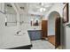 Bathroom with white countertops, tile floors, storage space, and decorative accents at 12371 Talpa St, Spring Hill, FL 34608