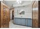 Bathroom features a vanity with storage, white tile, and decorative accents at 12371 Talpa St, Spring Hill, FL 34608