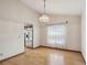 Dining room with wood floors and chandelier at 12371 Talpa St, Spring Hill, FL 34608