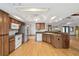 Kitchen area features wood cabinets, a window and recessed lighting at 12371 Talpa St, Spring Hill, FL 34608