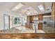 Kitchen features light-filled breakfast nook with windows and stainless steel appliances at 12371 Talpa St, Spring Hill, FL 34608