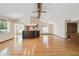 Living room featuring hardwood floors, natural light, and wet bar at 12371 Talpa St, Spring Hill, FL 34608