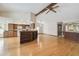 Open floor plan featuring the living room and kitchen with hardwood floors at 12371 Talpa St, Spring Hill, FL 34608