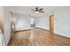 Living room features laminate floors, neutral paint tones, and archway access to other rooms at 12371 Talpa St, Spring Hill, FL 34608