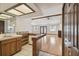 Wet bar situated near living area features a sink, shelving, and access to the living room at 12371 Talpa St, Spring Hill, FL 34608