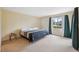 Spacious bedroom with large window providing ample natural light and outdoor views at 143 Lakeside Dr # 143, Oldsmar, FL 34677