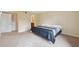 Large bedroom with adjacent bathroom and large closet for ample storage space at 143 Lakeside Dr # 143, Oldsmar, FL 34677