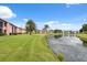 Community exterior showcasing pristine landscaping and a serene pond at 143 Lakeside Dr # 143, Oldsmar, FL 34677