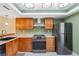 Galley-style kitchen featuring stainless steel appliances, marble countertops, and modern cabinetry at 143 Lakeside Dr # 143, Oldsmar, FL 34677