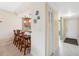 Cozy eat-in kitchen with bar seating, white appliances, and tile flooring at 143 Lakeside Dr # 143, Oldsmar, FL 34677