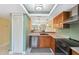Efficiently designed kitchen with stainless steel appliances, granite counters and sleek cabinetry at 143 Lakeside Dr # 143, Oldsmar, FL 34677