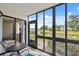 Enjoy a great outdoor view of the pond from this home's lovely screened lanai at 143 Lakeside Dr # 143, Oldsmar, FL 34677