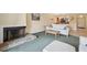 Cozy living room with a fireplace and open access to the dining area and kitchen at 143 Lakeside Dr # 143, Oldsmar, FL 34677