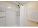 Modern shower stall with built in shelving, a shower curtain, and neutral wall colors at 143 Lakeside Dr # 143, Oldsmar, FL 34677
