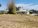 Expansive backyard with a shed and a waterside bench, providing a tranquil outdoor setting at 1447 Lemon Bay Dr, Englewood, FL 34223