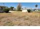 Expansive backyard with shed featuring lush greenery, providing a private outdoor space at 1447 Lemon Bay Dr, Englewood, FL 34223
