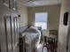 Cozy bedroom with a twin bed, tile flooring, and a bright window, perfect for relaxation and comfort at 1447 Lemon Bay Dr, Englewood, FL 34223