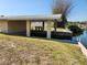 A waterfront property with a covered boat dock on a canal, providing direct access to the water at 1447 Lemon Bay Dr, Englewood, FL 34223