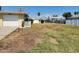 Spacious yard featuring white fence and mature landscaping at 1447 Lemon Bay Dr, Englewood, FL 34223