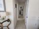 Bright hallway with neutral decor, offering seamless access to various rooms, and enhancing flow at 1447 Lemon Bay Dr, Englewood, FL 34223