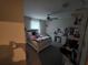 Bedroom featuring carpet floors, a ceiling fan and a decorative vanity at 1561 Flower Dust Dr, Ruskin, FL 33570