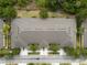 An aerial shot showing roof of the property, trees and street view of the area at 1713 Trailwater St, Ruskin, FL 33570