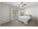 Cozy bedroom with a large window providing natural light and neutral tones at 1713 Trailwater St, Ruskin, FL 33570
