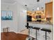 Stylish kitchen bar area with granite countertops, pendant lighting, and modern stools at 1713 Trailwater St, Ruskin, FL 33570