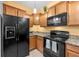Well-equipped kitchen with granite countertops, stainless steel appliances, and ample cabinet space at 1713 Trailwater St, Ruskin, FL 33570