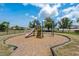 A colorful playground with a slide and climbing equipment offers a fun and safe play area for children at 1713 Trailwater St, Ruskin, FL 33570