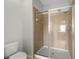 Bathroom shower stall featuring glass door, upgraded shower head, and tile surround at 1713 Trailwater St, Ruskin, FL 33570
