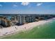 A picturesque beach scene with modern condos and direct access to pristine sands at 17408 Gulf Blvd # 203, Redington Shores, FL 33708