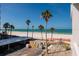 Picture of balcony with beach views, palm trees and blue skies at 17408 Gulf Blvd # 203, Redington Shores, FL 33708