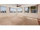 Bright bedroom has neutral carpet and large windows with beautiful street views at 17408 Gulf Blvd # 203, Redington Shores, FL 33708