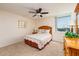 Cozy bedroom featuring a ceiling fan, one window and simple decor at 17408 Gulf Blvd # 203, Redington Shores, FL 33708