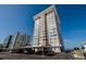 Exterior view of a tall condo building with beach access and covered parking at 17408 Gulf Blvd # 203, Redington Shores, FL 33708