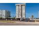 Exterior view of a tall condo building with beach access and covered parking at 17408 Gulf Blvd # 203, Redington Shores, FL 33708