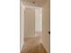 Hallway with neutral carpet at 17408 Gulf Blvd # 203, Redington Shores, FL 33708