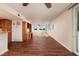 Spacious living room area boasting a beautiful view, hardwood floors and built in shelving and desk at 17408 Gulf Blvd # 203, Redington Shores, FL 33708