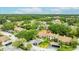 An aerial view of townhomes with well-maintained lawns, mature trees, and convenient parking at 1815 Cypress Trace Dr, Safety Harbor, FL 34695