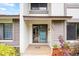 Inviting front entrance with tile floor, muted color palette, and decorative plants to complete the space at 1815 Cypress Trace Dr, Safety Harbor, FL 34695