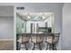 Kitchen bar features seating, with stainless steel appliances and light cabinetry visible at 1815 Cypress Trace Dr, Safety Harbor, FL 34695