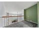 Loft area with an open railing overlooking the living space below and a view of the outdoors at 1815 Cypress Trace Dr, Safety Harbor, FL 34695
