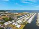 Panoramic aerial shot of waterfront homes, showcasing a well-planned community with numerous canals and a picturesque coastal setting at 18675 Us Highway 19 N # 261, Clearwater, FL 33764