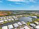 Expansive aerial view of waterfront homes, highlighting the community's canals, lush greenery, and access to larger bodies of water at 18675 Us Highway 19 N # 261, Clearwater, FL 33764
