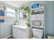 Charming bathroom featuring modern fixtures, decorative plants, and ample counter space for added appeal at 18675 Us Highway 19 N # 261, Clearwater, FL 33764