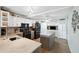 Well-lit kitchen featuring white cabinets, a center island, and modern appliances at 18675 Us Highway 19 N # 261, Clearwater, FL 33764
