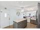 Open kitchen layout with center island and view to the living and dining room at 18675 Us Highway 19 N # 261, Clearwater, FL 33764